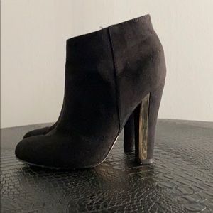 Black booties with Gold trim detail on heels